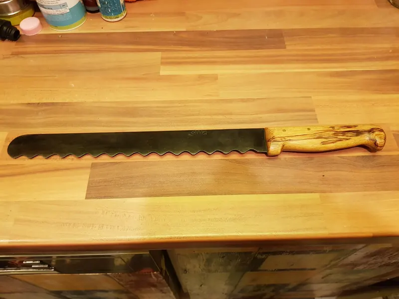 Bread knife with a light wooden handle, finished project