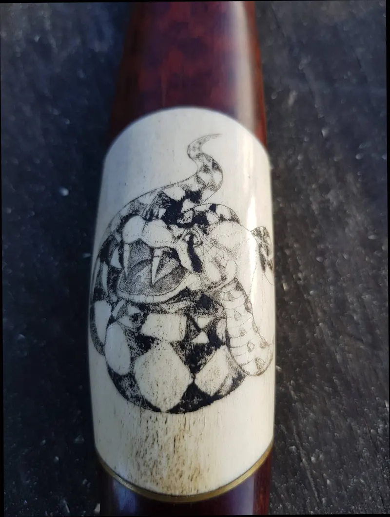 Close-up of the illustrated pale panel in the knife handle
