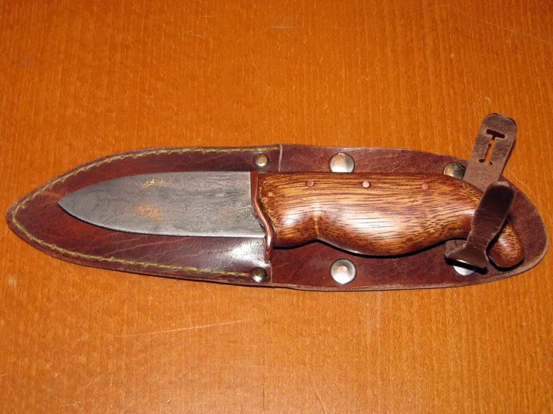 Damascus knife with a wooden handle, finished project
