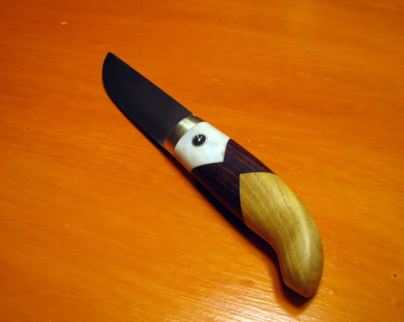 Tiden Flyr knife with its multicoloured handle and small clock detail
