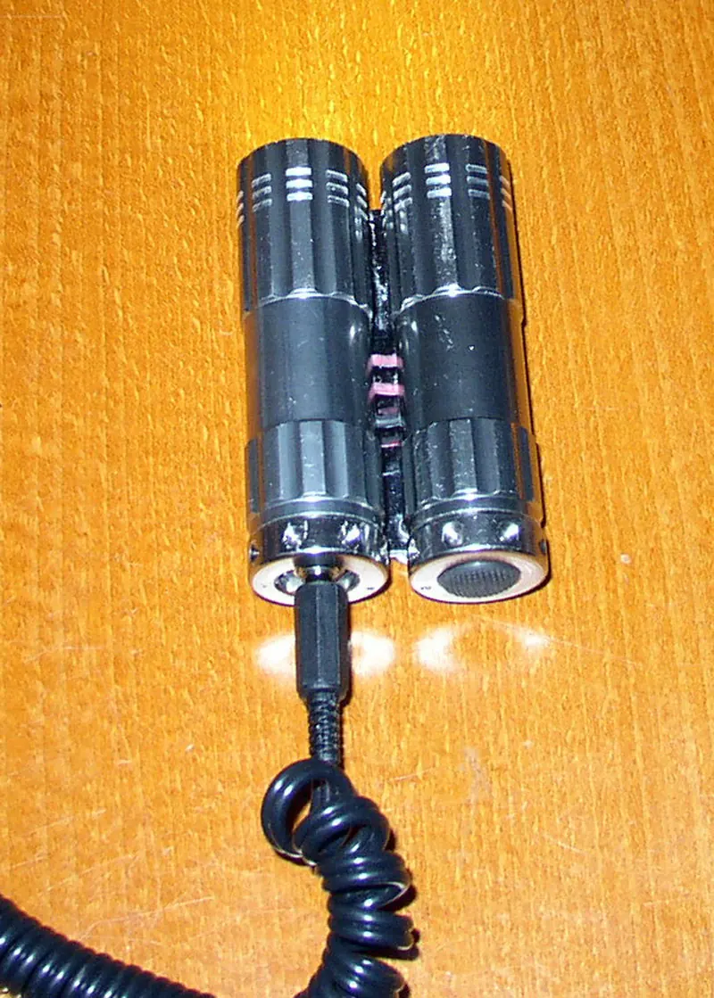Two repurposed metal torches joined into a compact twin-LED cycling headlamp