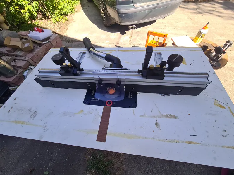 Completed router table with an adjustable fence and router lift