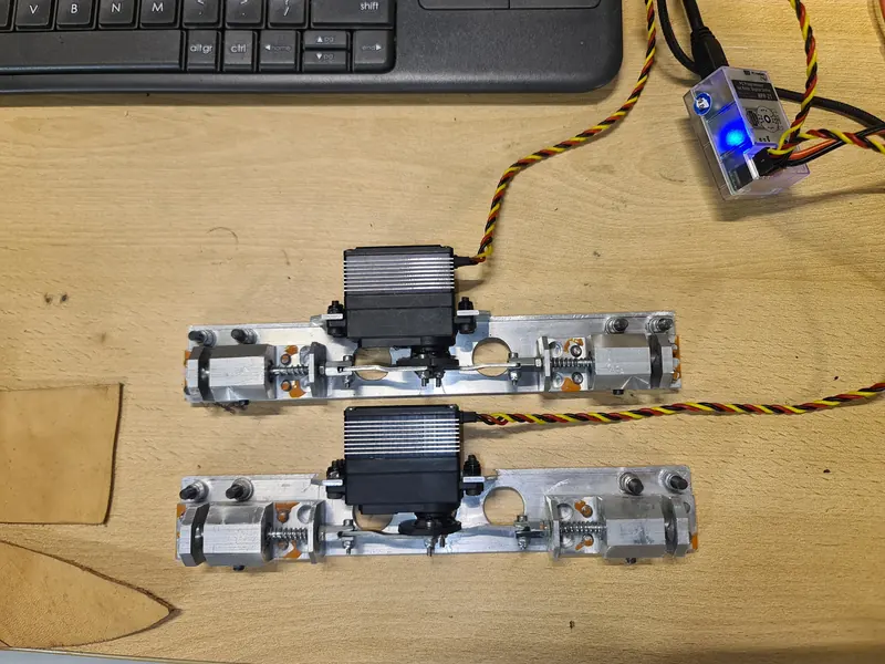 Two servo-operated mechanisms on the workshop bench